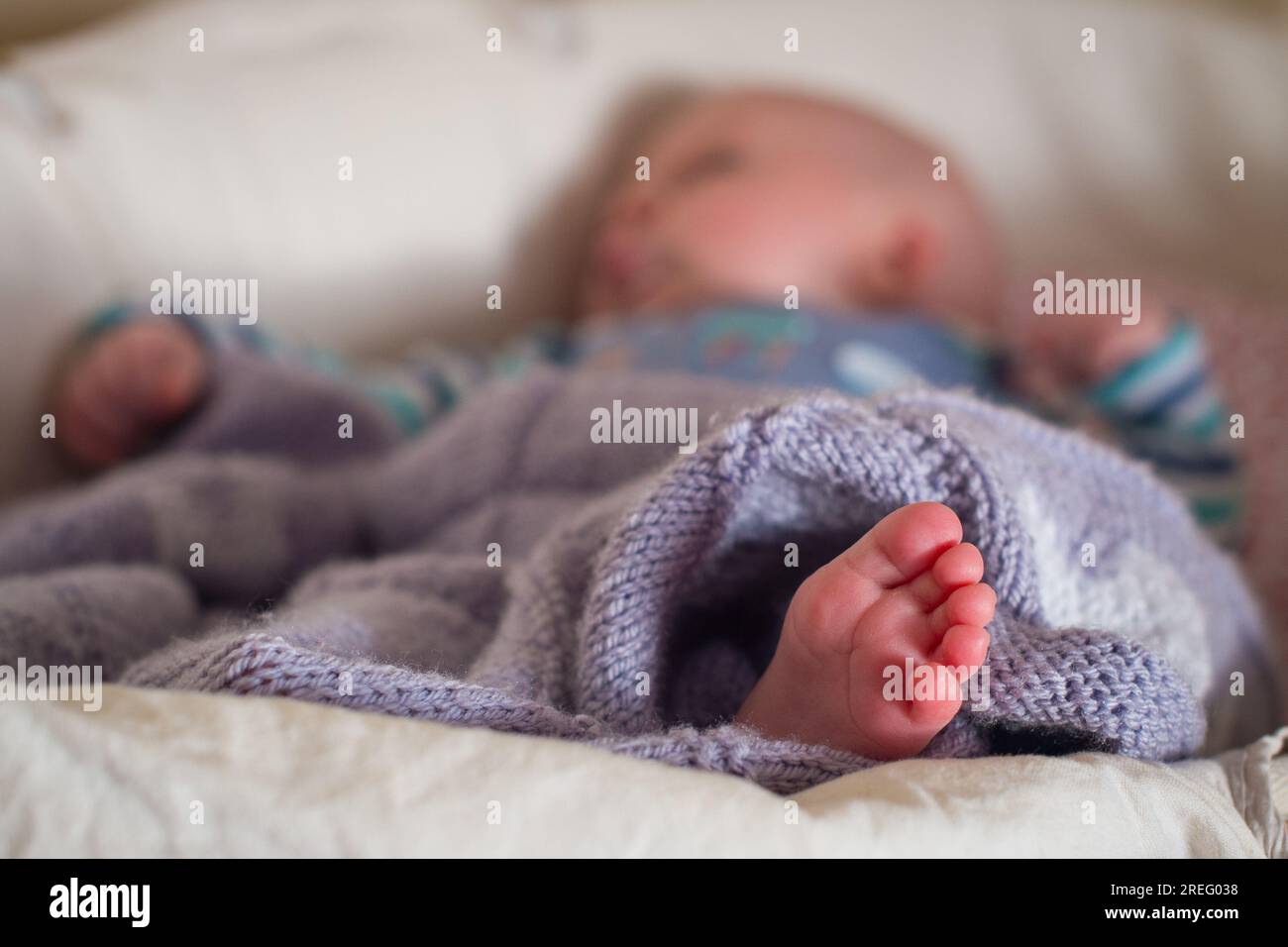 File photo dated 24/01/2016 of a baby sleeping in a basket. Babies and toddlers who nap a lot may have smaller vocabularies and poorer memory and thinking skills, research suggests. Stock Photo