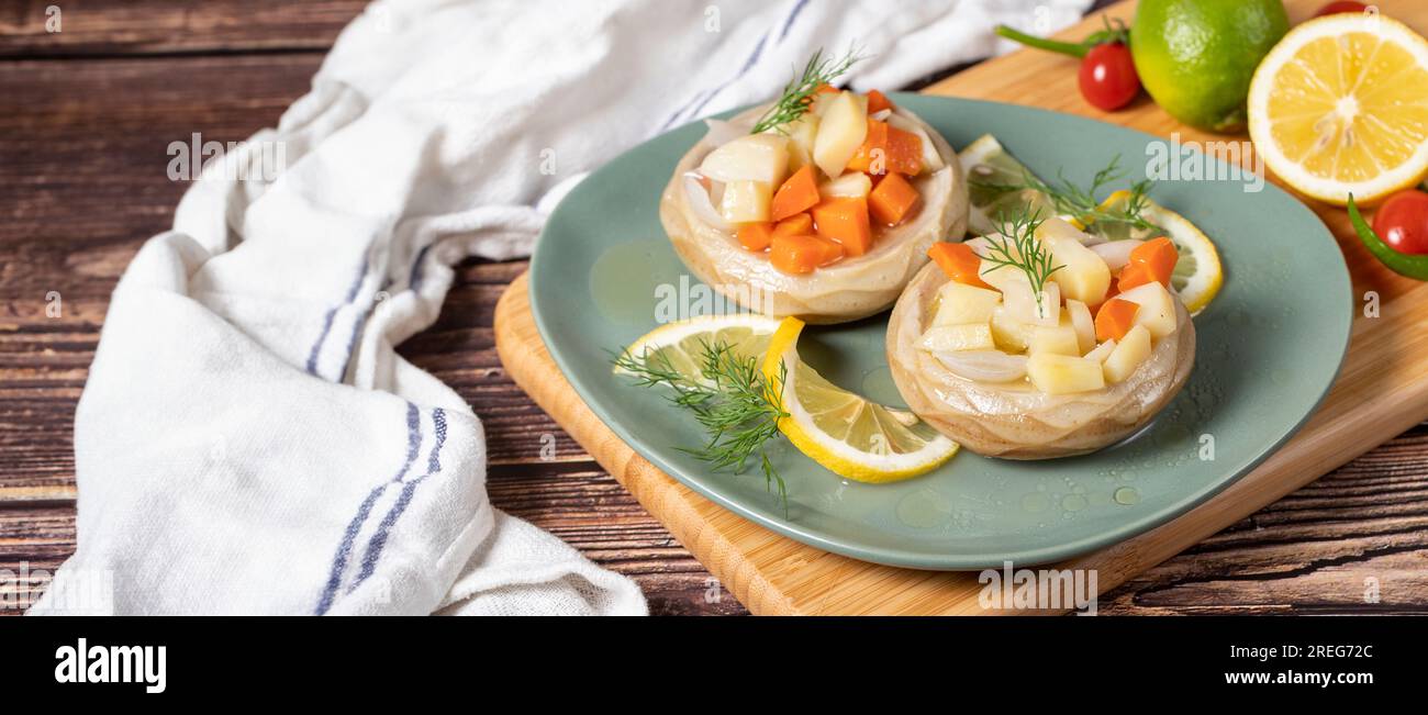 Artichoke dish with olive oil. Turkish cuisine delicacies. Artichoke made with lemon juice, carrots, potatoes, peas, onions, olive oil, sugar and salt Stock Photo