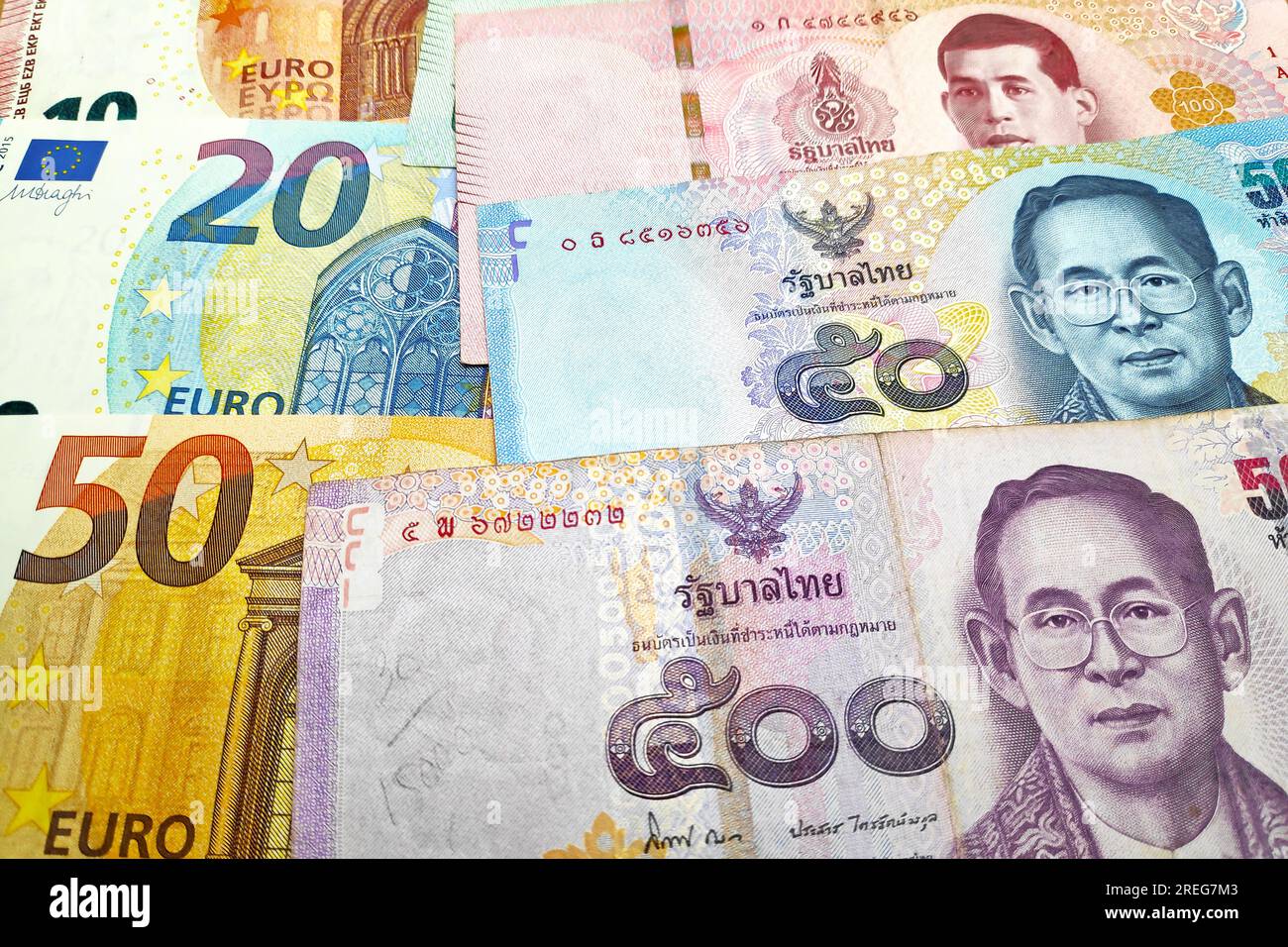 Closeup on a stack of Euros and Thai Baht Stock Photo Alamy
