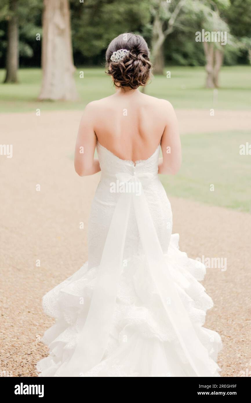 Back of bride in white strapless lace wedding dress Stock Photo