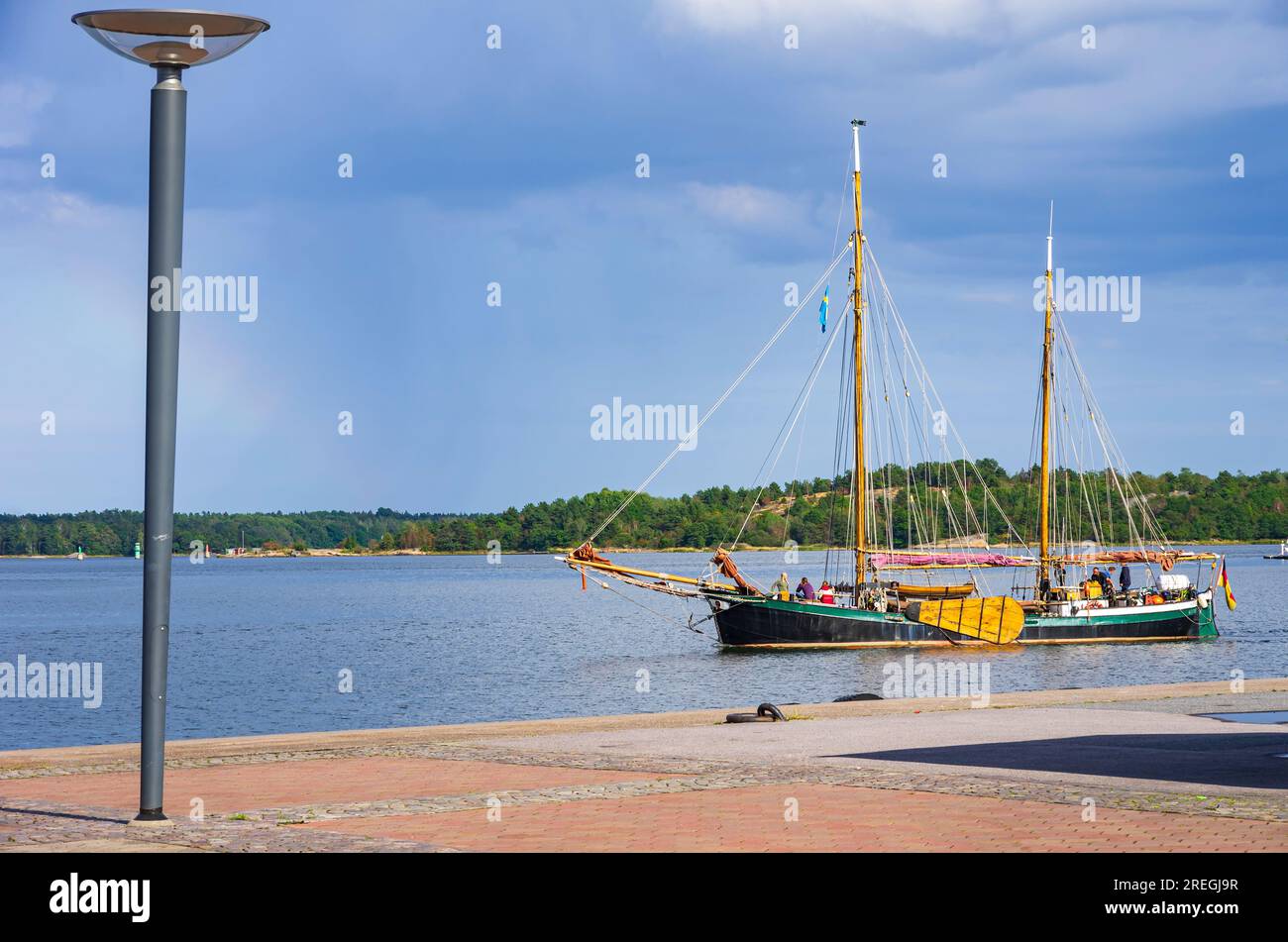 A historic twomasted sailing vessel under German flag enters the