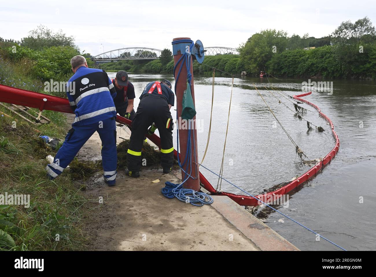Bohumin, Czech Republic. 28th July, 2023. Firefighters and workers of the Odra River basin remove a floating barrier that was placed in the Odra River on the Czech-Polish border due to fish mortality, Bohumin, Karvina region, July 28, 2023. According to the Czech Environmental Inspectorate, the death of fish could have been caused by a lack of oxygen in the river. Credit: Jaroslav Ozana/CTK Photo/Alamy Live News Stock Photo