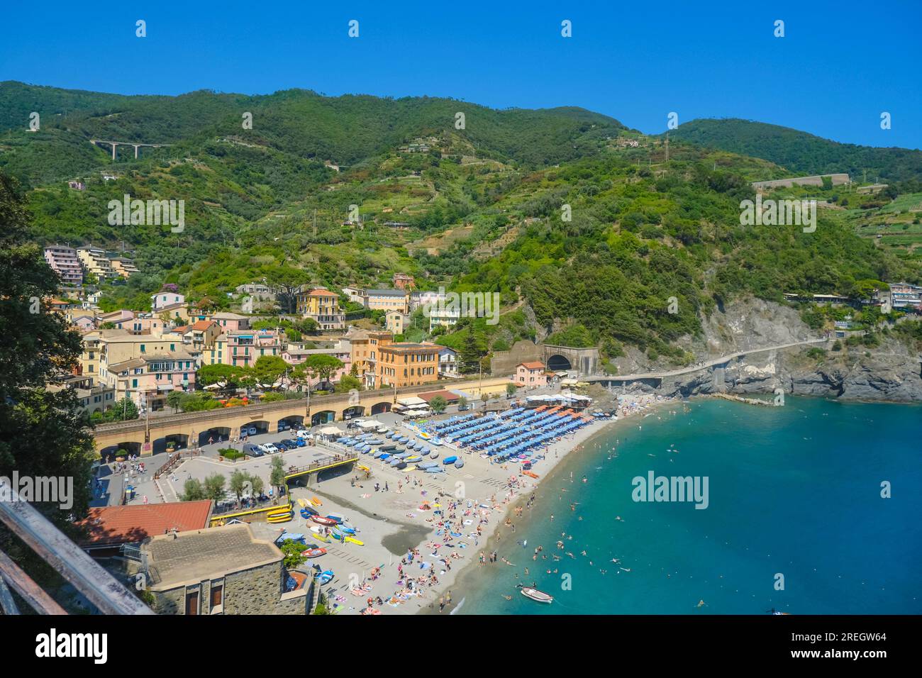 aerial view over beach chairs and umbrellas on the beach of Monterosso ...