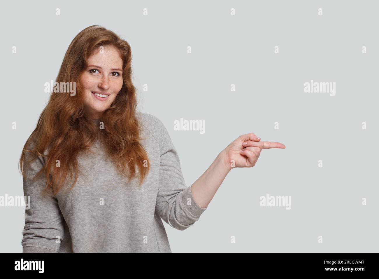 Ginger pointing portrait woman hi-res stock photography and images - Alamy