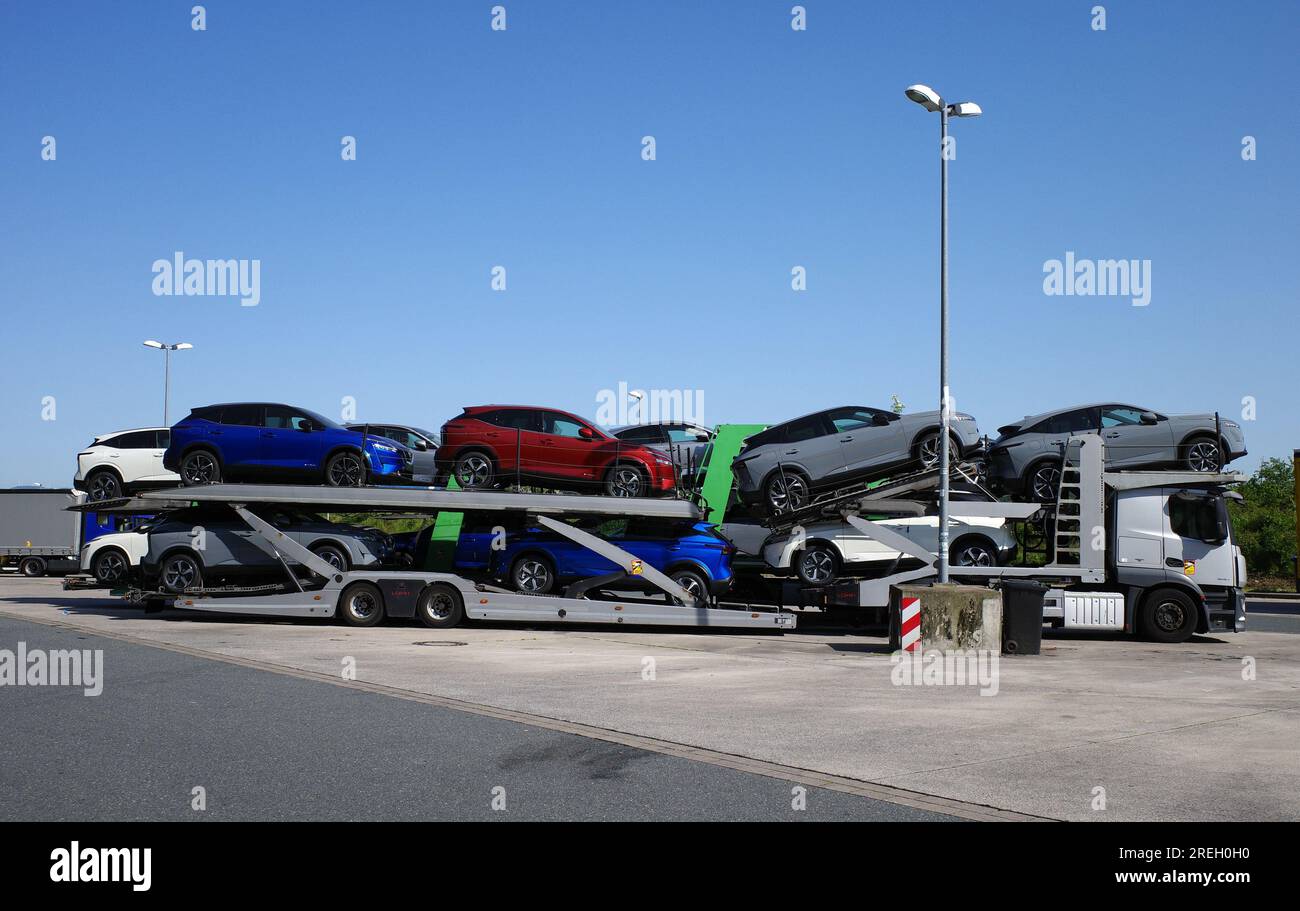 Osnabrück - Germany - June 4 2023  A truck full of new cars. The new vehicles are Nissan Qashqai e power Stock Photo