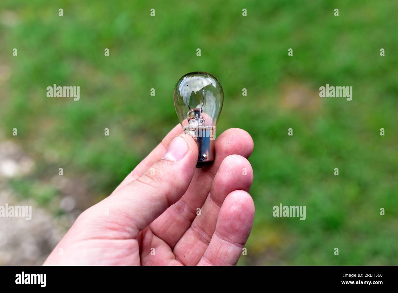 Car lowbeam and highbeam light bulbs in your hands Stock Photo Alamy