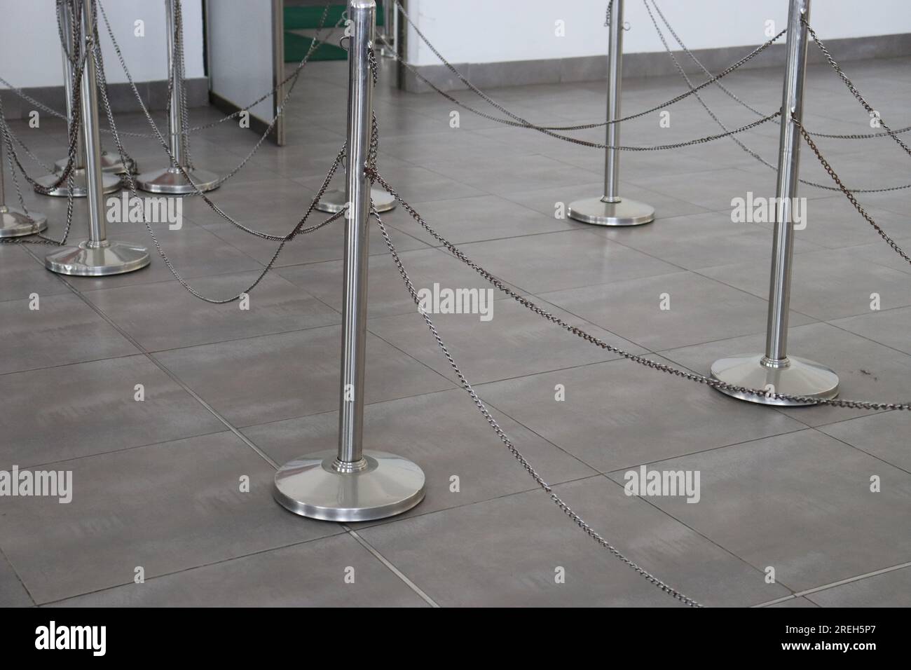 Stainless steel balusters with chain fencing, metal fence barricade, chain railing used to control the crowd Stock Photo