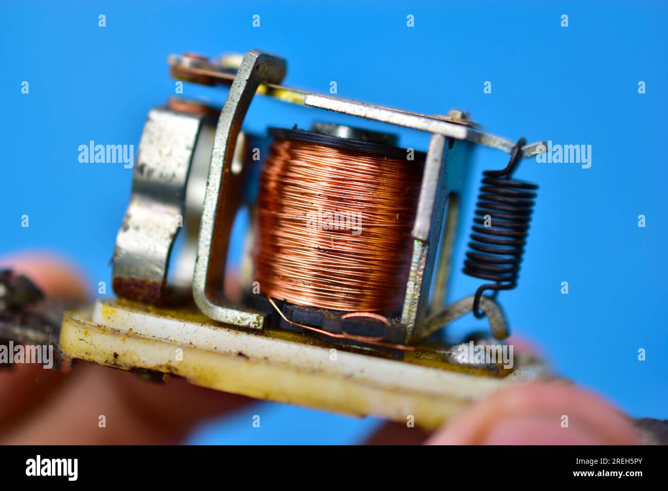 Copper coil switch in the hands of a master Stock Photo