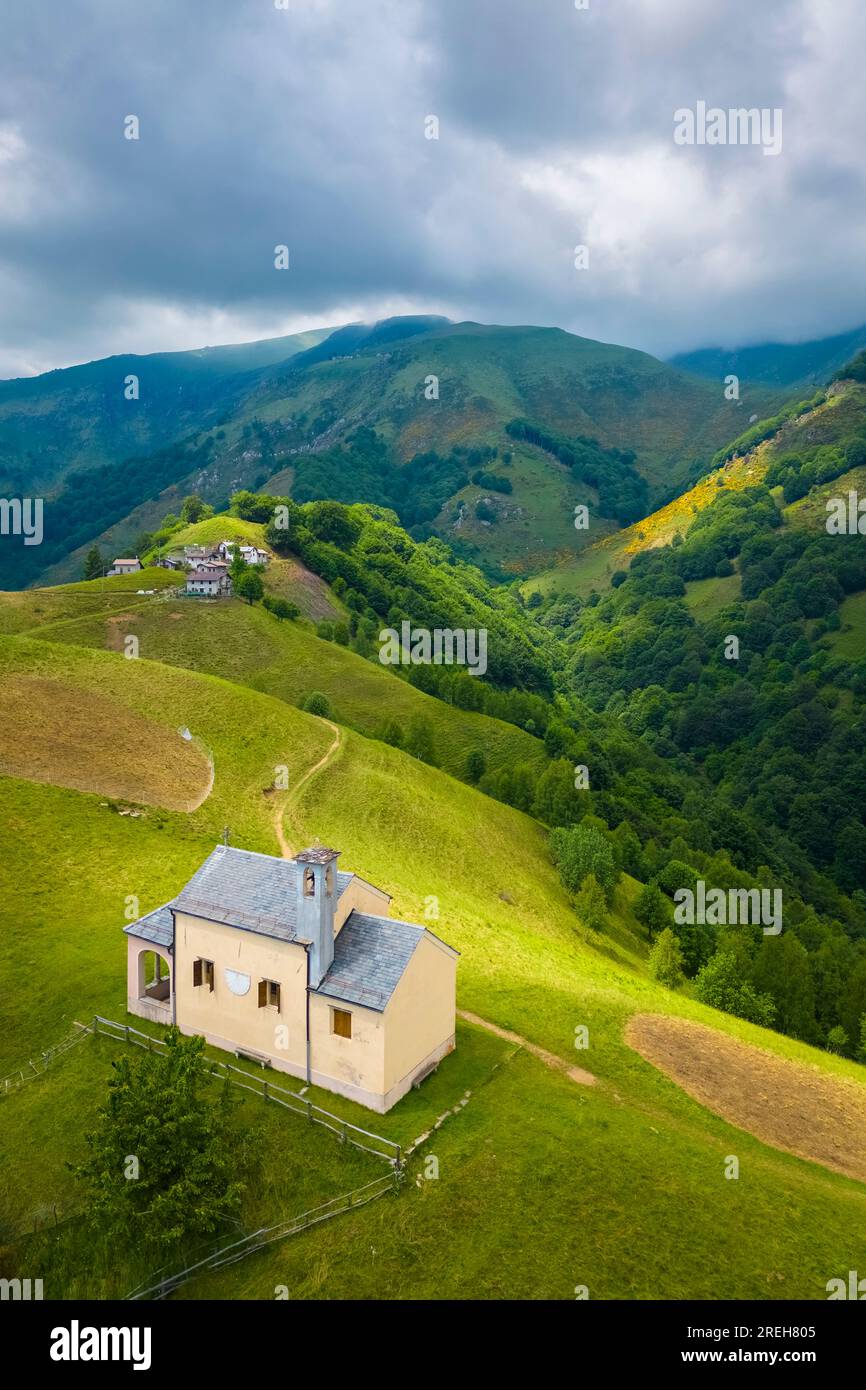 Aerial view of the small church at Alpe Loccia. Chesio, Loreglia, Alpe Loccia, Valstrona, Verbano Cusio Ossola district, Piedmont, Italy. Stock Photo