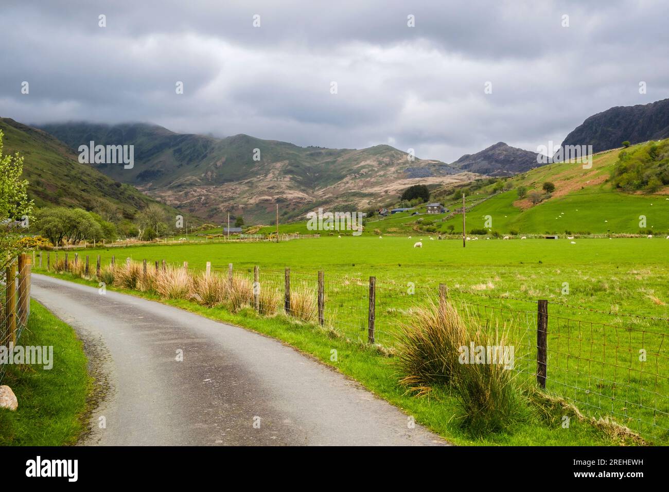 View along narrow country lane up Cwm Pennant valley in Snowdonia
