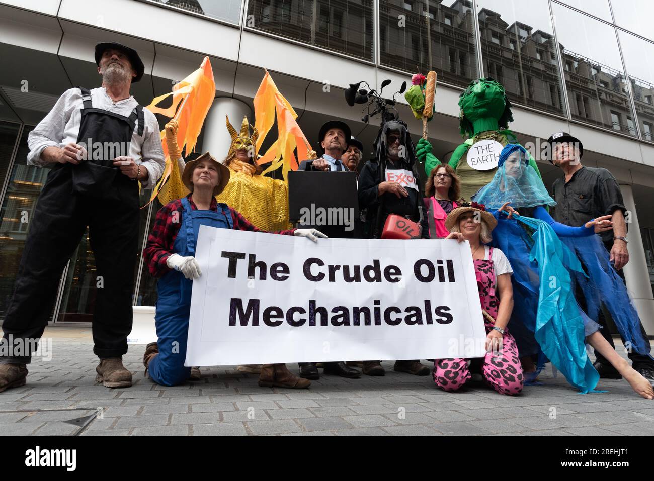 London, UK. 28 July, 2023. Climate activists 'The Crude Oil Mechanicals' perform a theatrical protest outside the London headquarters of BlackRock, one of the world's largest fund managers and which is heavily invested in fossil fuels. The action follows remarks the previous day by UN secretary general António Guterres that "climate change is here. It is terrifying. And it is just the beginning". Credit: Ron Fassbender/Alamy Live News Stock Photo