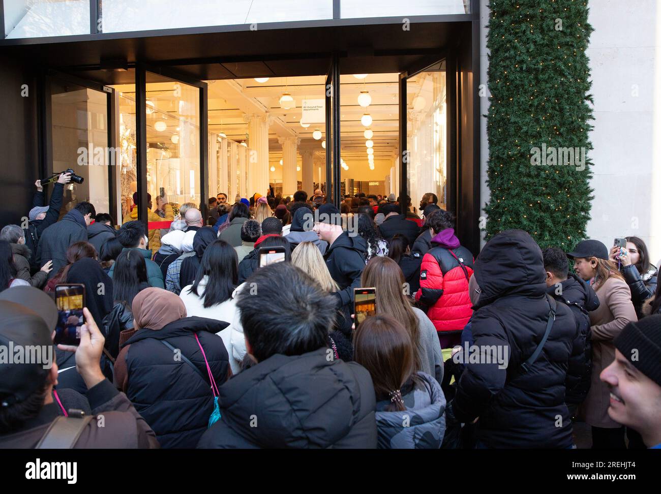 People enter Selfridges store on Oxford Street in London, at the
