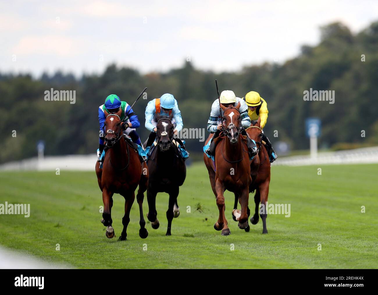 City Streak ridden by jockey Jason Watson (blue silks and yellow cap) on their way to winning the John Guest Racing Handicap during the QIPCO King George Weekend at Ascot Racecourse, Berkshire. Picture date: Friday July 28, 2023. Stock Photo