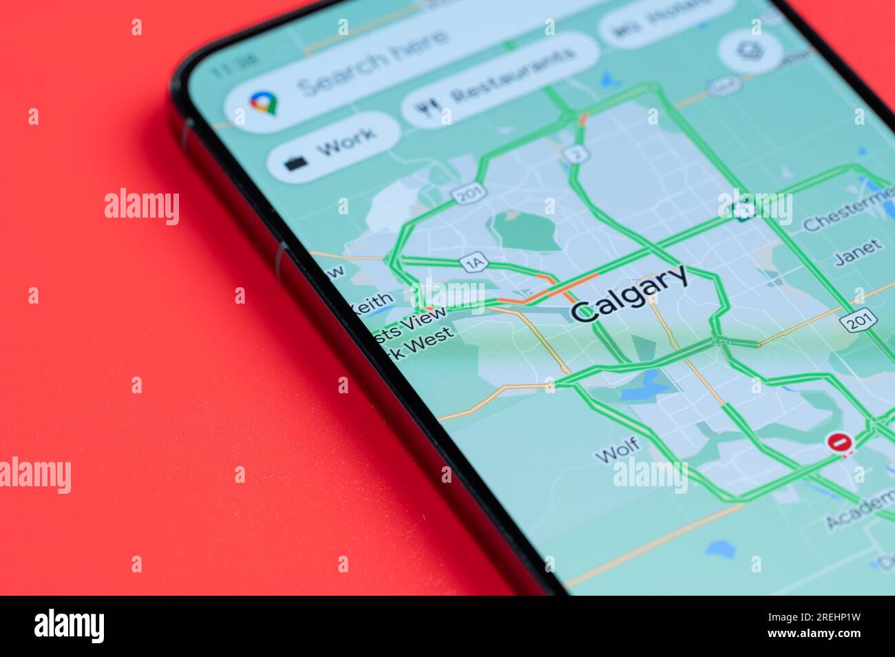 New York, USA - July 21, 2023: Car traffic in Calgary  on google maps in smartphone screen close up view Stock Photo