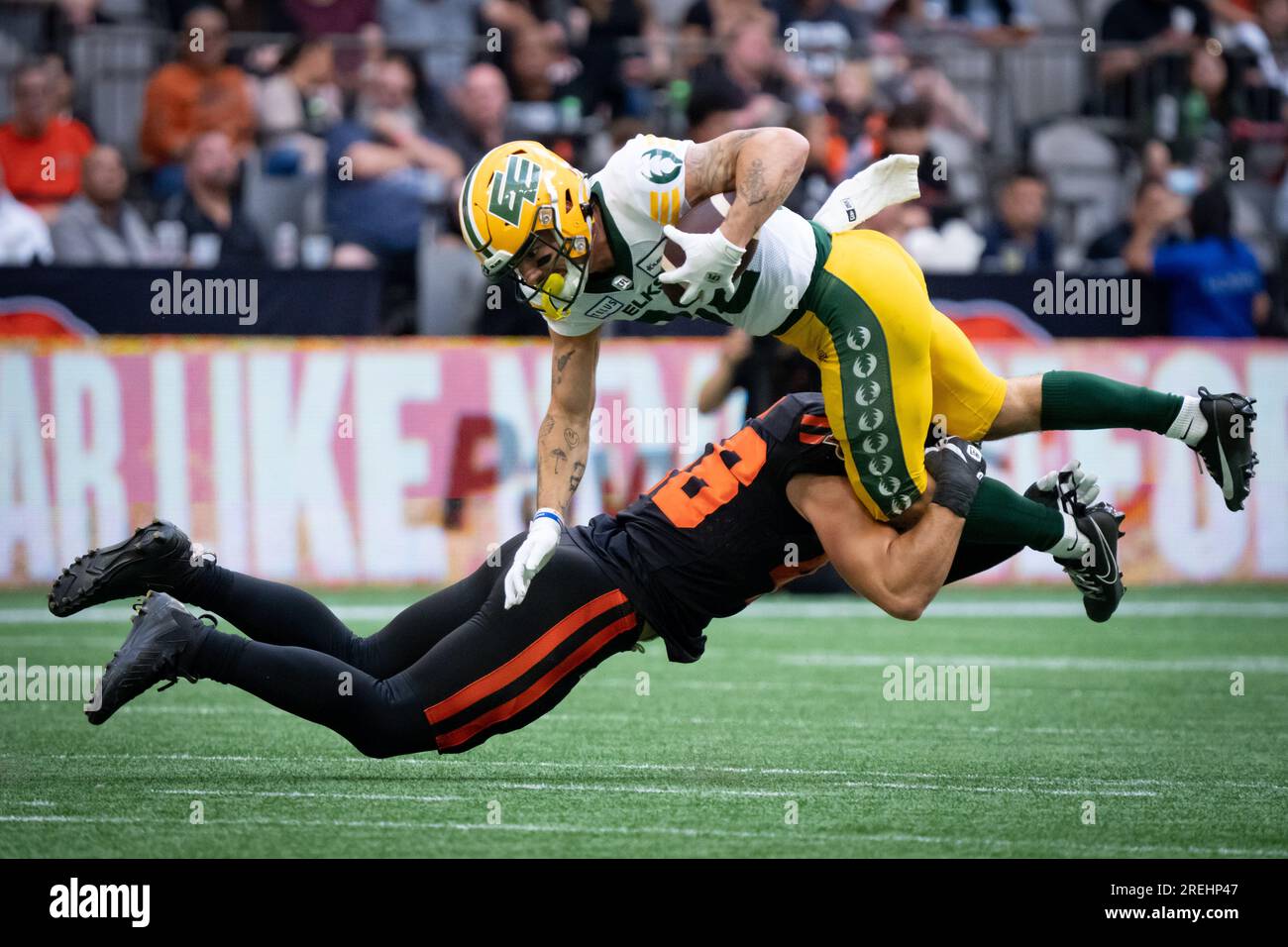 Vancouver, Canada. 17th June, 2023. B.C. Lions linebacker Ben Hladik (46)  tackles Edmonton Elks wide receiver Vincent Forbes-Mombleau (82) during the  first half of a CFL football game, in Vancouver, on Saturday,