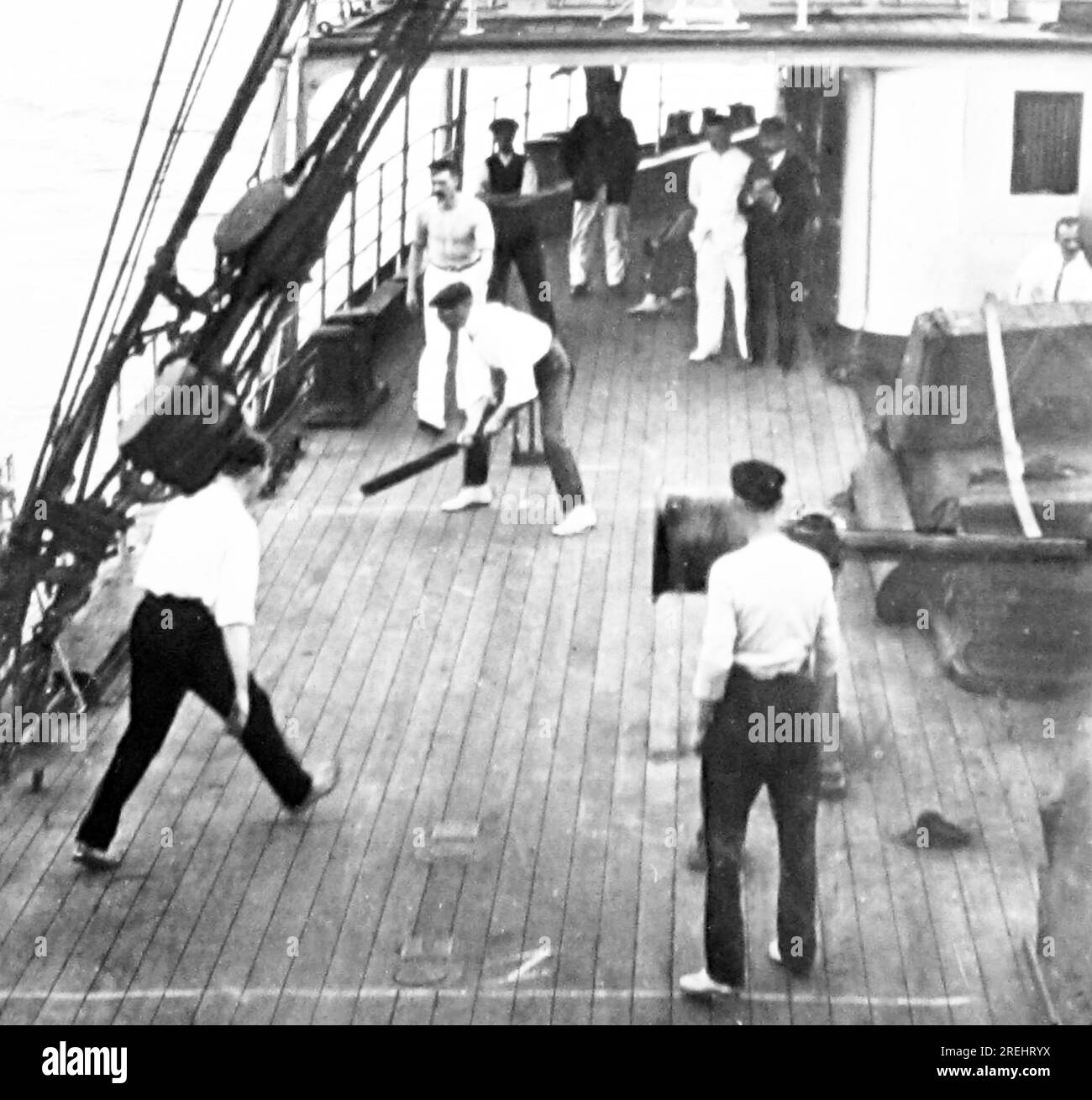 Playing cricket on a ship, Victorian period Stock Photo