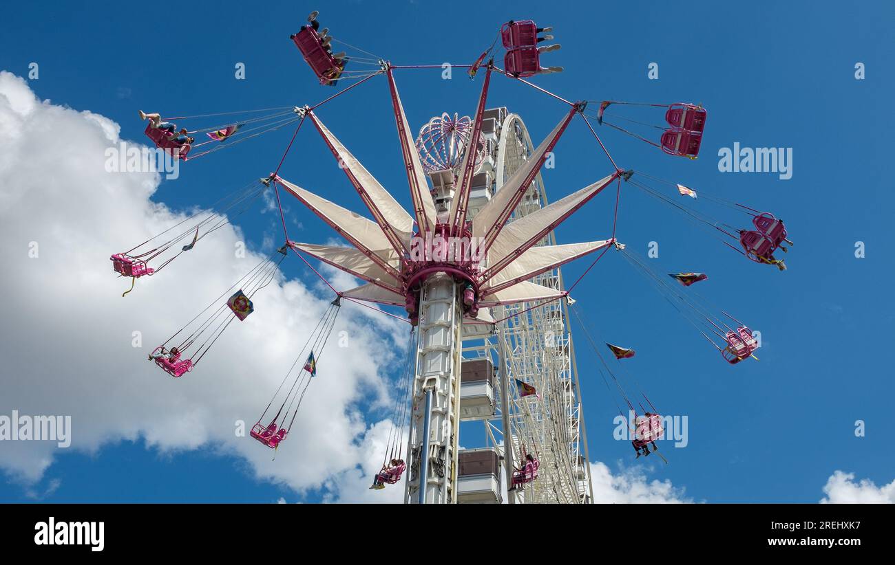 Paris, France, 2021. Pink and white starflyer chair ride at the ...