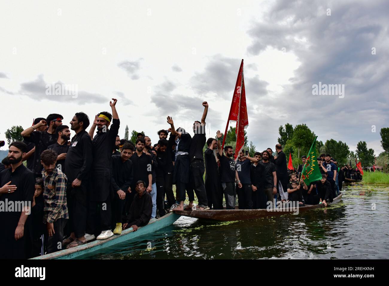 Kashmiri Shiite Muslims shout religious slogans as they participate in ...