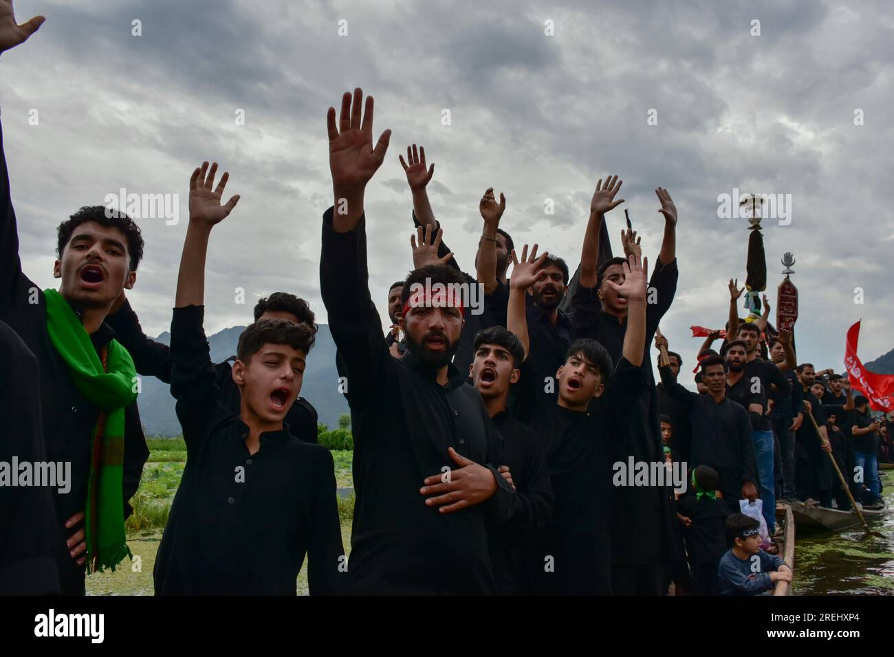 Kashmiri Shiite Muslims shout religious slogans as they participate in ...