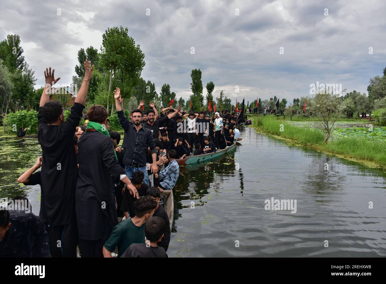 Kashmiri Shiite Muslims shout religious slogans as they participate in ...