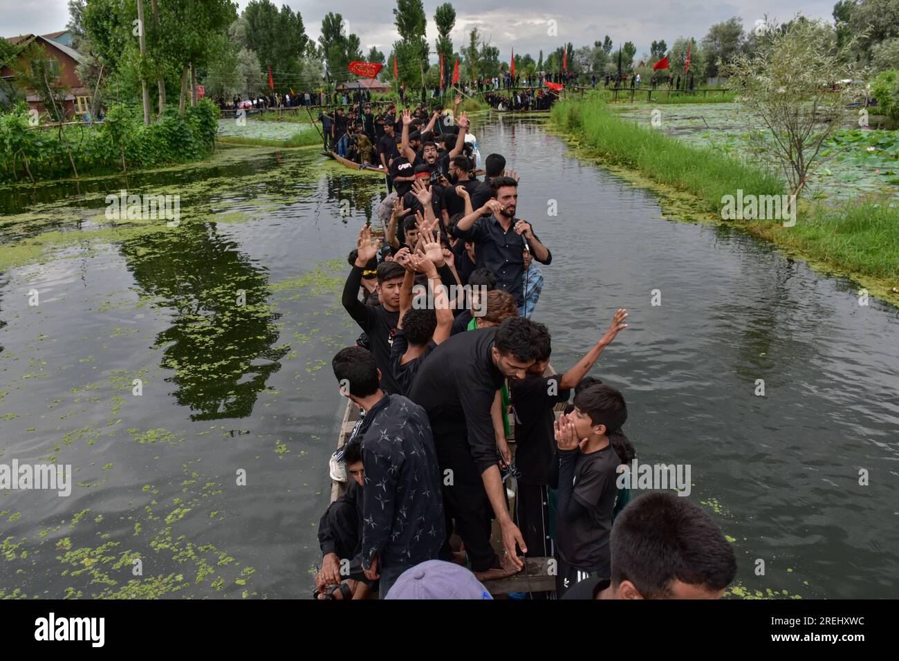 Kashmiri Shiite Muslims shout religious slogans as they participate in ...
