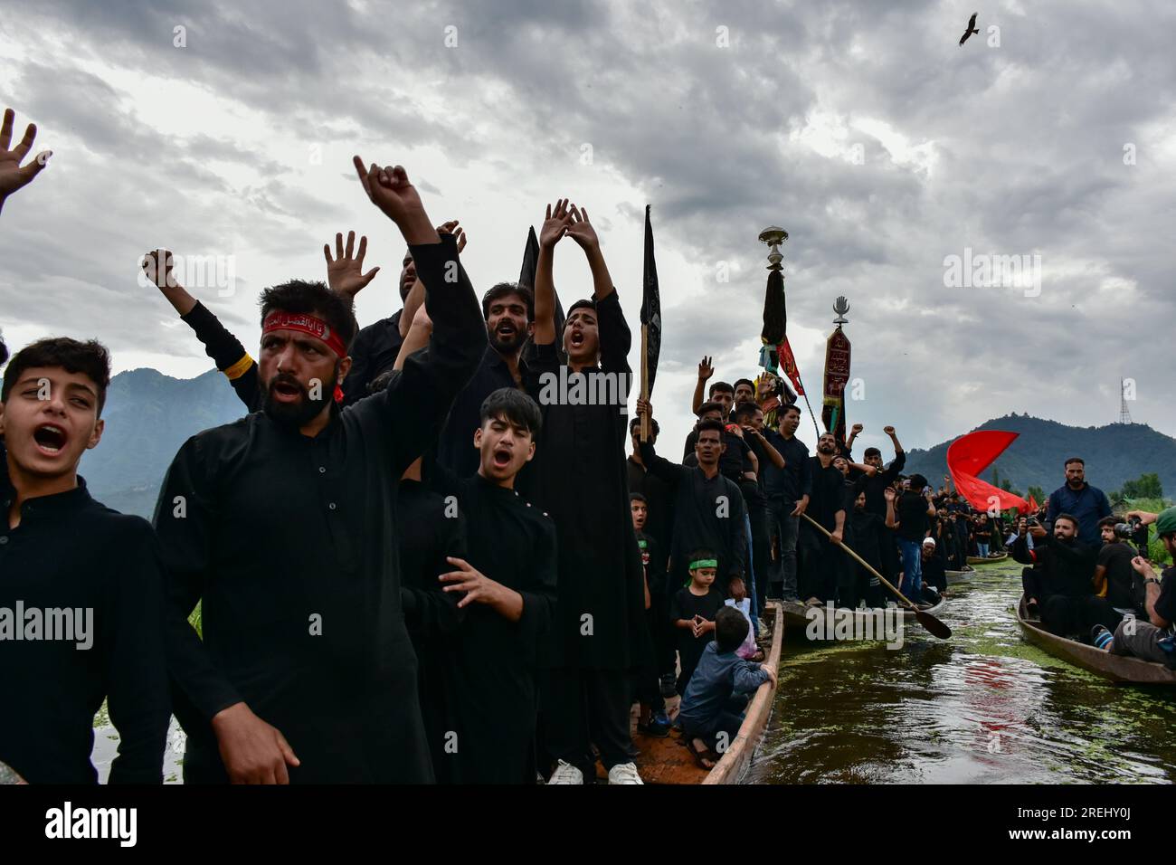 Kashmiri Shiite Muslims shout religious slogans as they participate in ...
