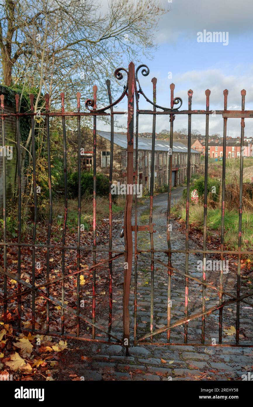 Metal gates leading to a former cotton mill. Cob Wall, Blackburn Stock