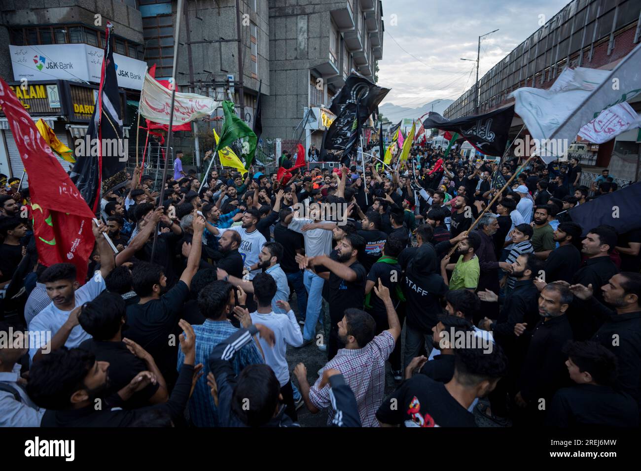 Kashmiri Shiite Muslims shout religious slogans as they participate in ...
