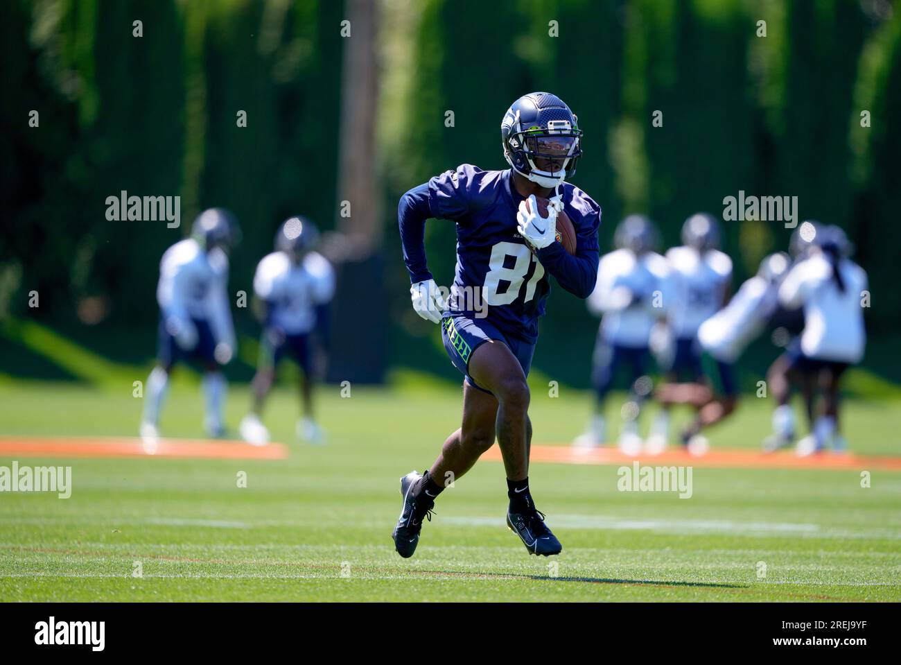 Seattle Seahawks wide receiver Tyjon Lindsey (81) holds a football while  running a receiving drill during the NFL football team's training camp,  Wednesday, July 26, 2023, in Renton, Wash. (AP Photo/Lindsey Wasson