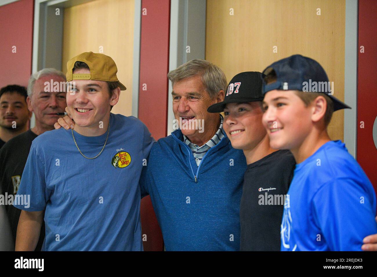 BOSTON, MA - JULY 26: Bobby Orr, Hockey Hall of Fame member who also won  two Stanley Cup championships with the Boston Bruins (second from right),  poses for a photo with fans