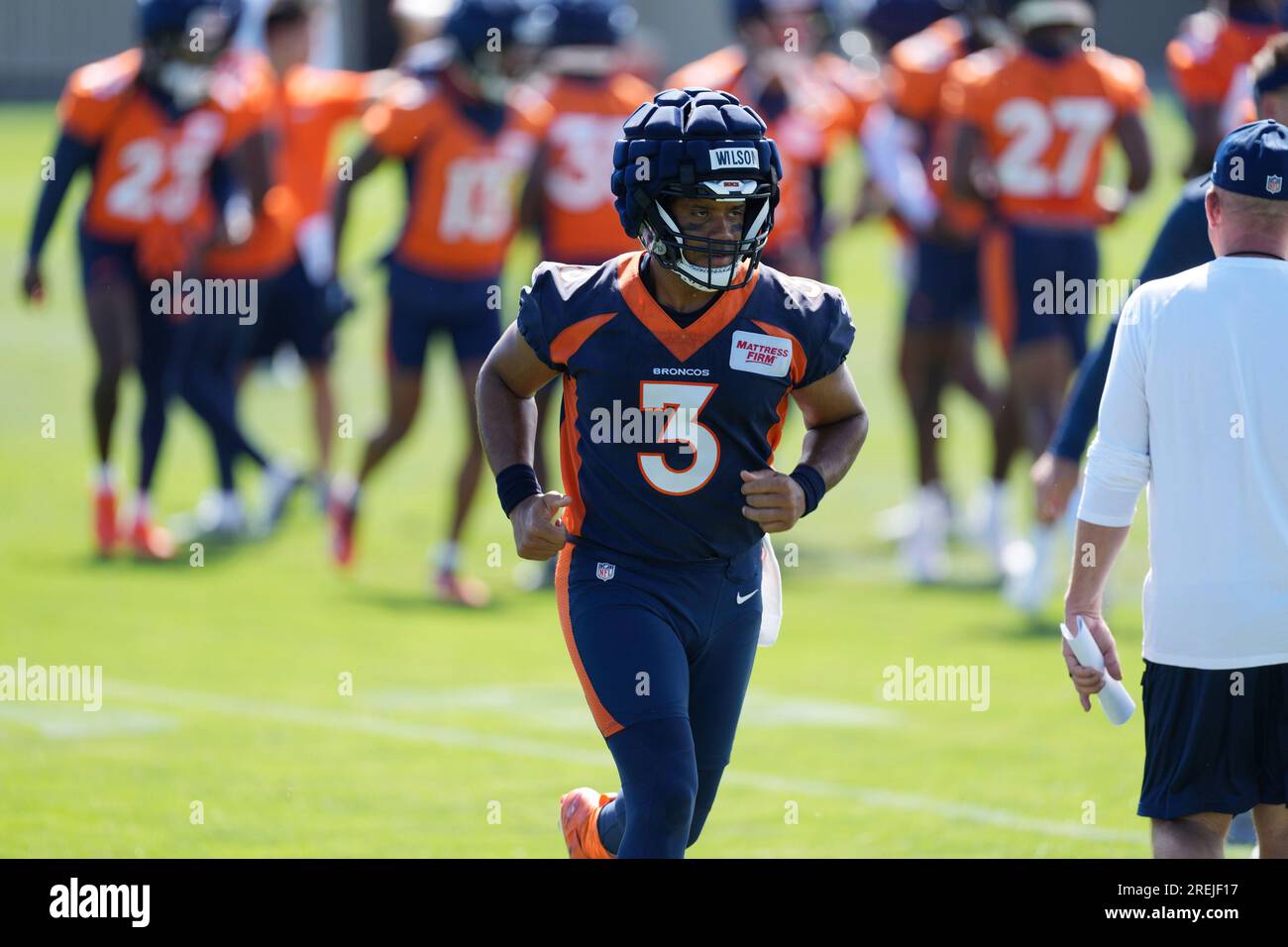 Denver Broncos quarterback Russell Wilson (3) takes part in drills