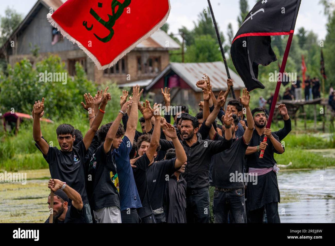 Kashmiri Shiite Muslims shout religious slogans as they participate in ...