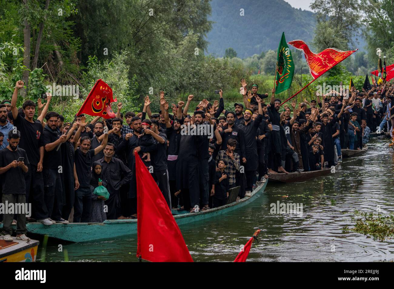 Kashmiri Shiite Muslims shout religious slogans as they participate in ...
