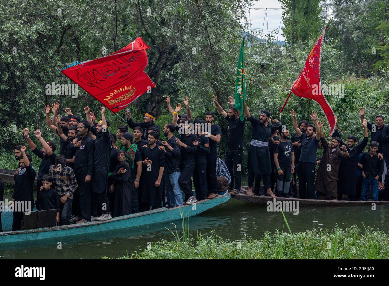 Kashmiri Shiite Muslims shout religious slogans as they participate in ...