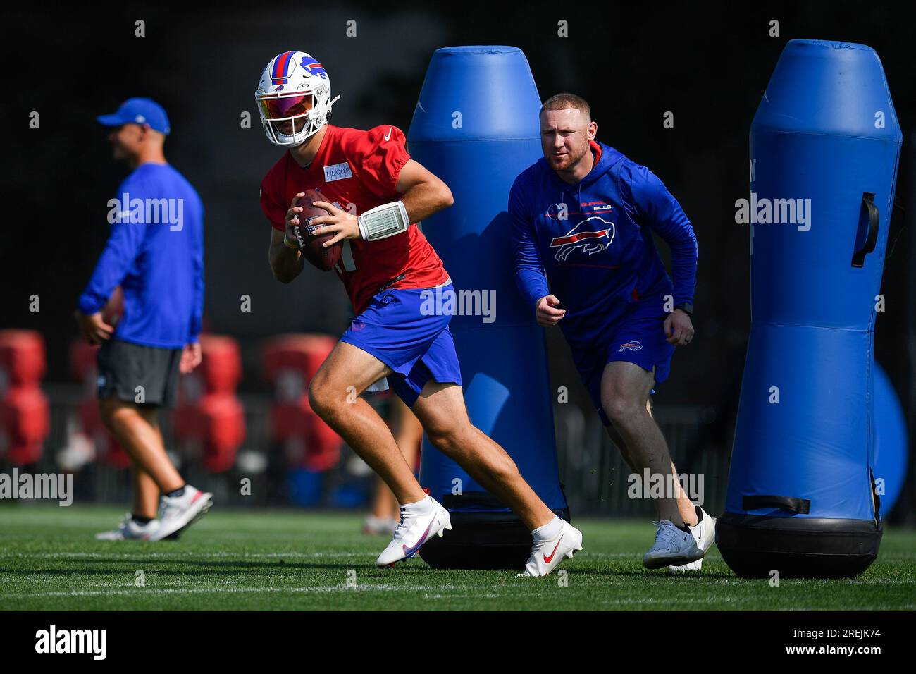 Buffalo Bills quarterback Josh Allen runs a drill with quarterbacks