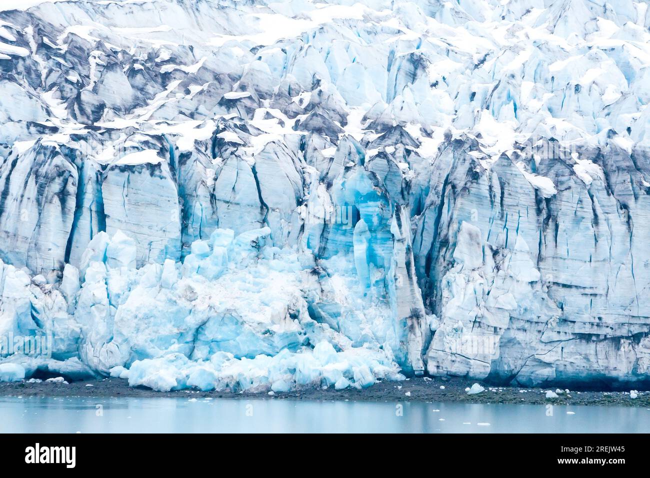 Close up of the blue ice of the Lamplugh Glacier terminus in Glacier Bay National Park, Alaska Stock Photo