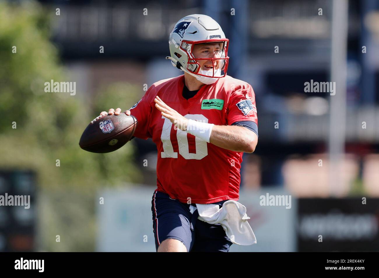 New England Patriots quarterback Mac Jones (10) runs passing drills