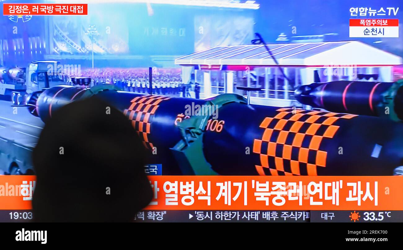Seoul, South Korea. 28th July, 2023. A TV screen shows an image of North's first-ever nuclear-armed unmanned underwater vehicle named the Haeil (Tsunami) at a military parade to mark the 70th anniversary of the signing of the armistice that halted the 1950-53 Korean War, during a news program at the Yongsanl Railway Station in Seoul. North Korea has staged a massive military parade to celebrate the 70th anniversary of the Korean War armistice, on July 28 its state media displayed its latest intercontinental ballistic missiles (ICBMs) and drones in a show of its military might. With senior offi Stock Photo
