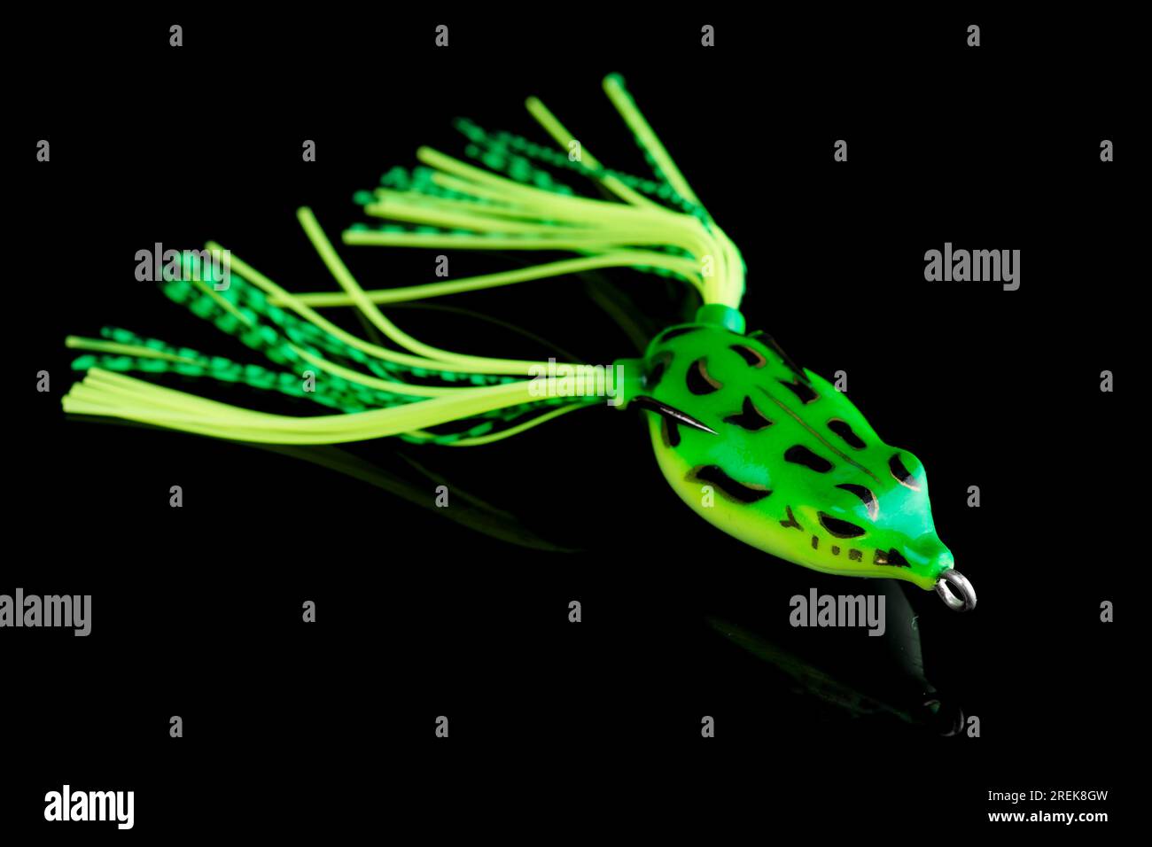 https://c8.alamy.com/comp/2REK8GW/silicone-frog-top-water-bait-for-pike-or-large-mouth-bass-fishing-isolated-on-black-background-2REK8GW.jpg