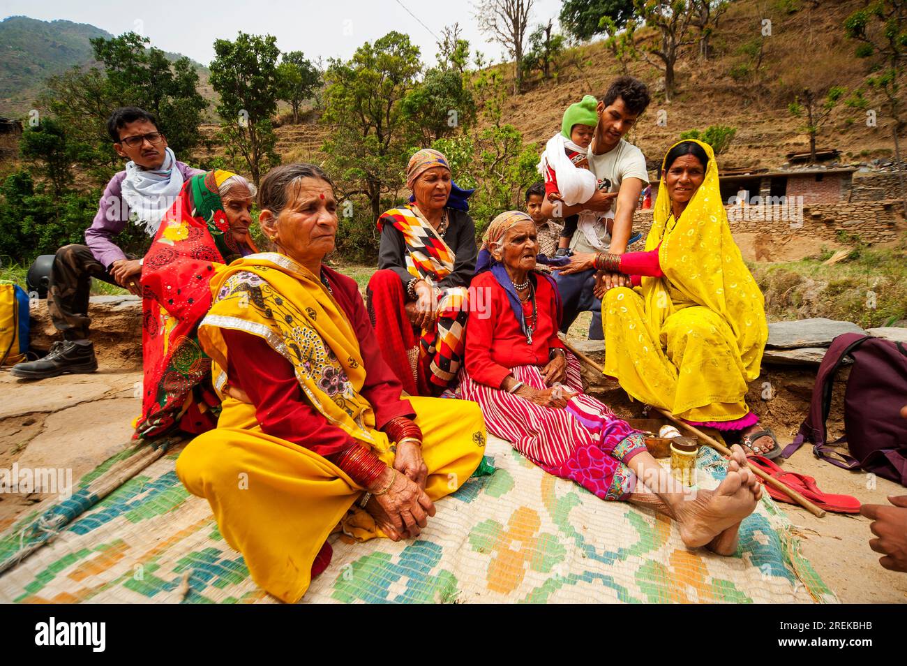 Indian womans in traditional saris at a family meeting on the banks of the Nandhour river on the Nandhour Valley, Dalkanya village, Uttarakhand, India Stock Photo