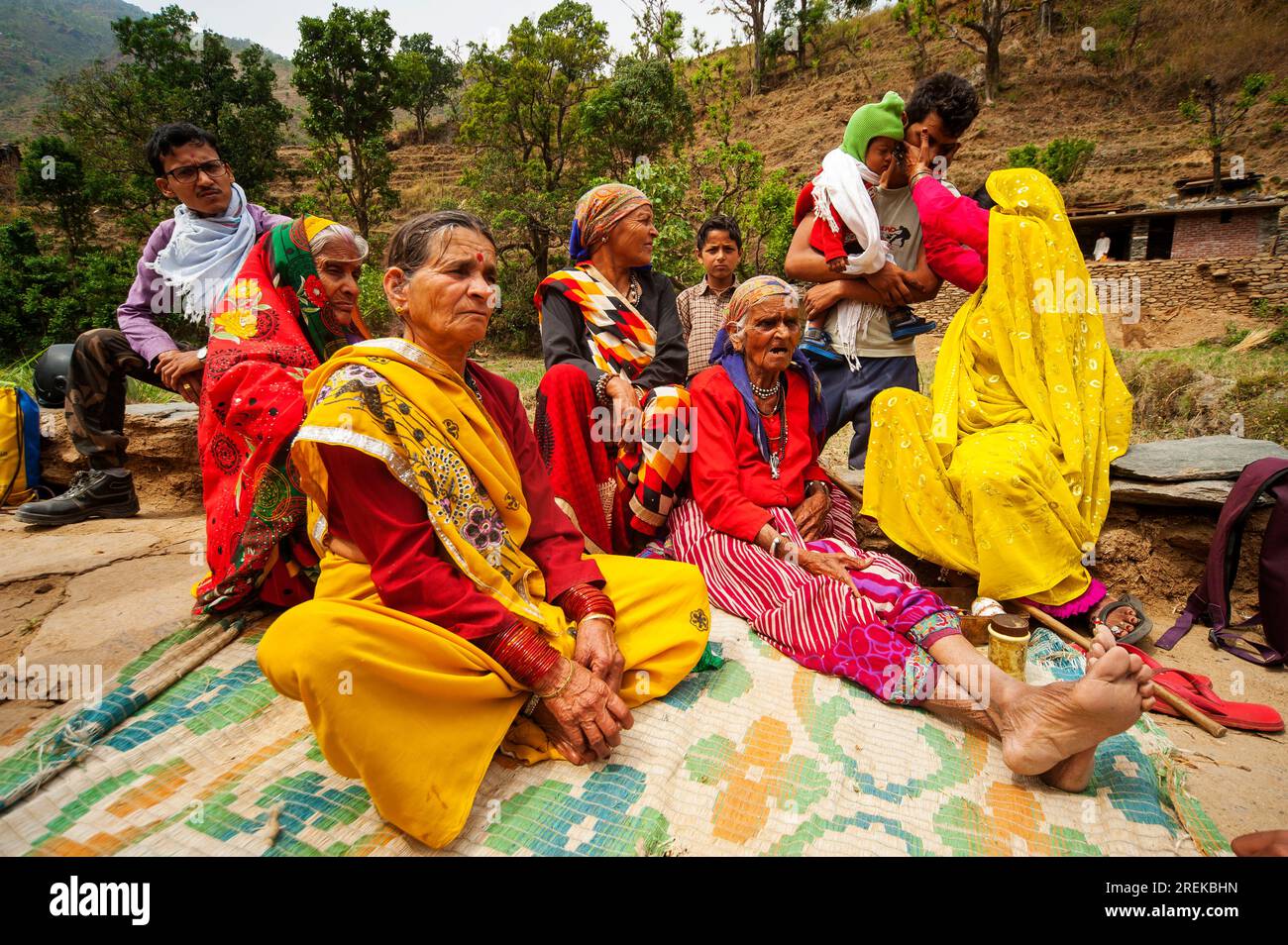 Indian womans in traditional saris at a family meeting on the banks of the Nandhour river on the Nandhour Valley, Dalkanya village, Uttarakhand, India Stock Photo