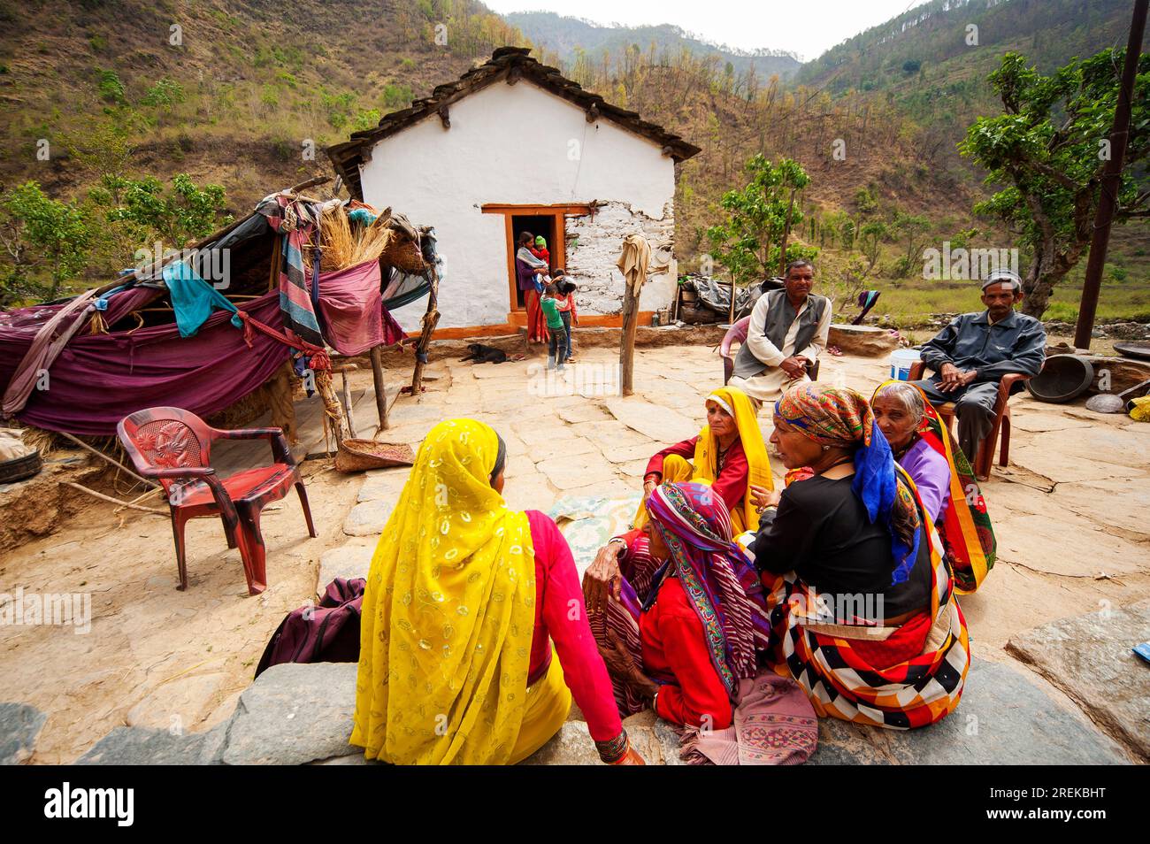 Indian womans in traditional saris at a family meeting on the banks of the Nandhour river on the Nandhour Valley, Dalkanya village, Uttarakhand, India Stock Photo