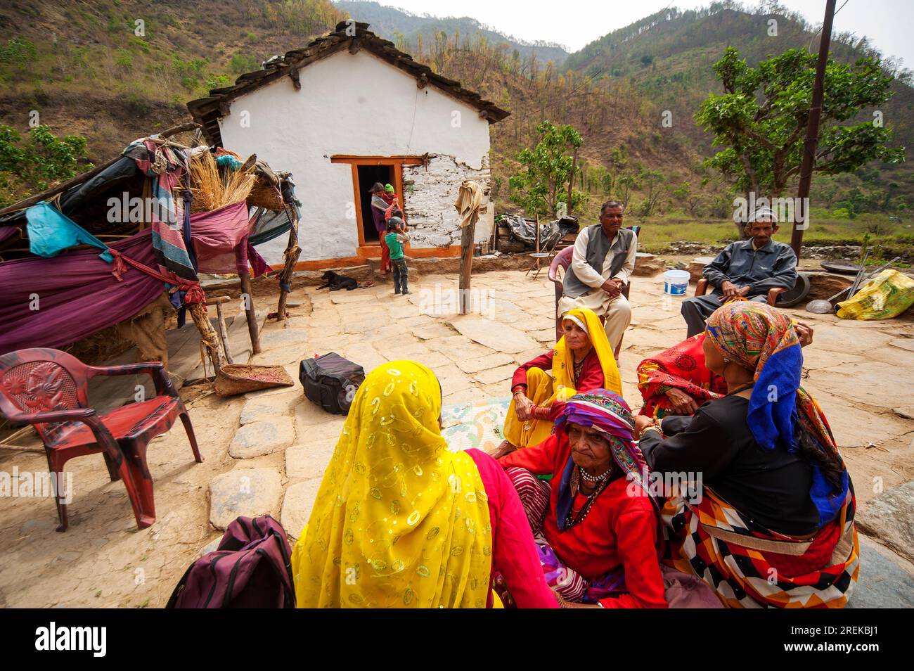 Indian womans in traditional saris at a family meeting on the banks of the Nandhour river on the Nandhour Valley, Dalkanya village, Uttarakhand, India Stock Photo