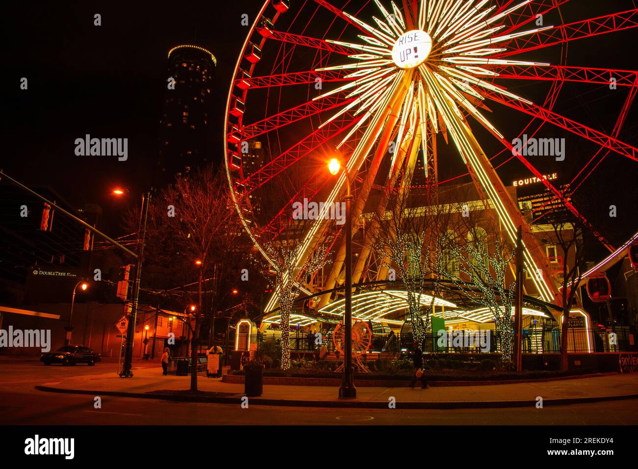 The SkyView Atlanta Ferris wheel stands out in the vibrant downtown Atlanta night. Stock Photo