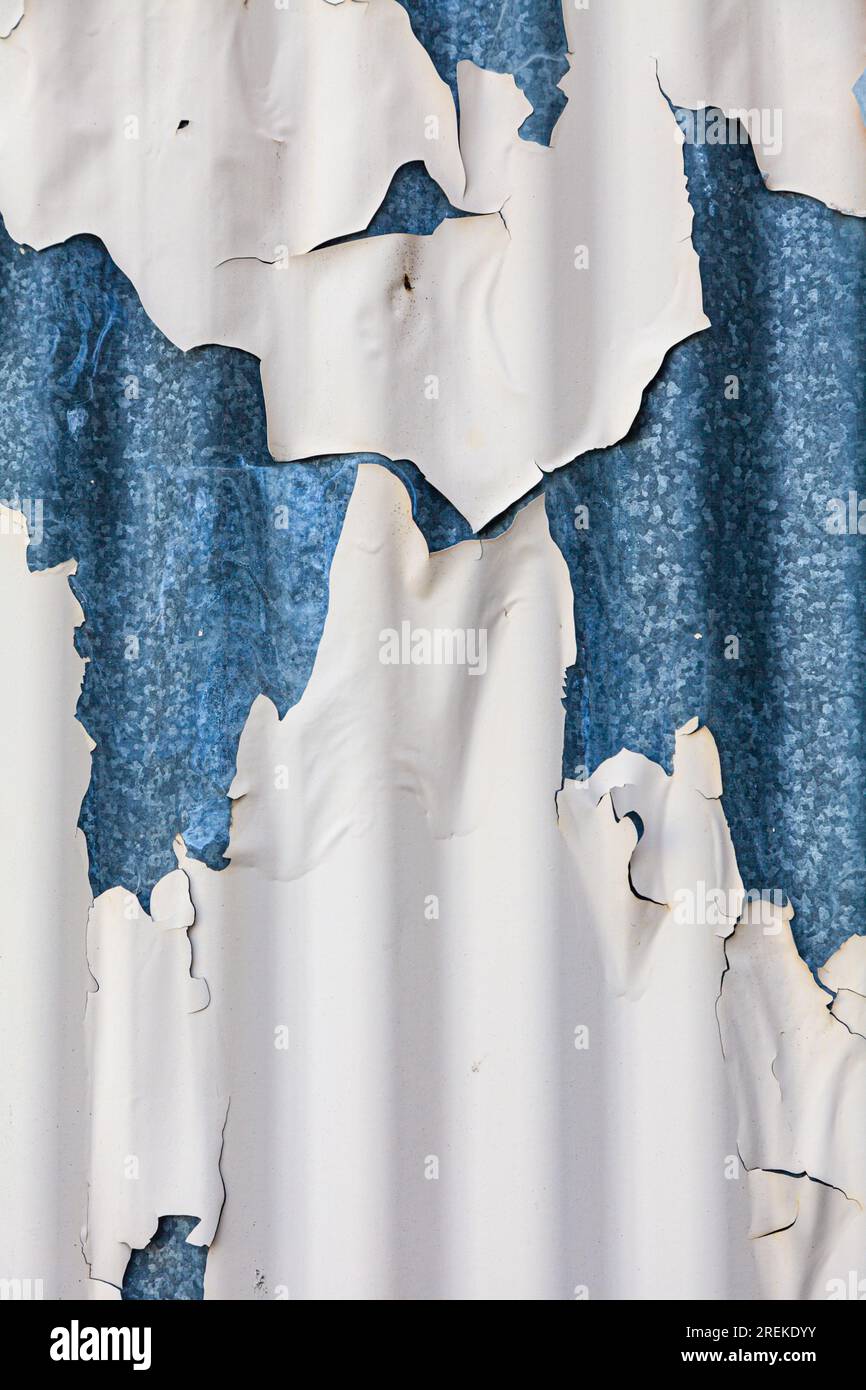 Cracked and peeling paint on corrugated steel cladding on Granville Island Vancouver, Canada