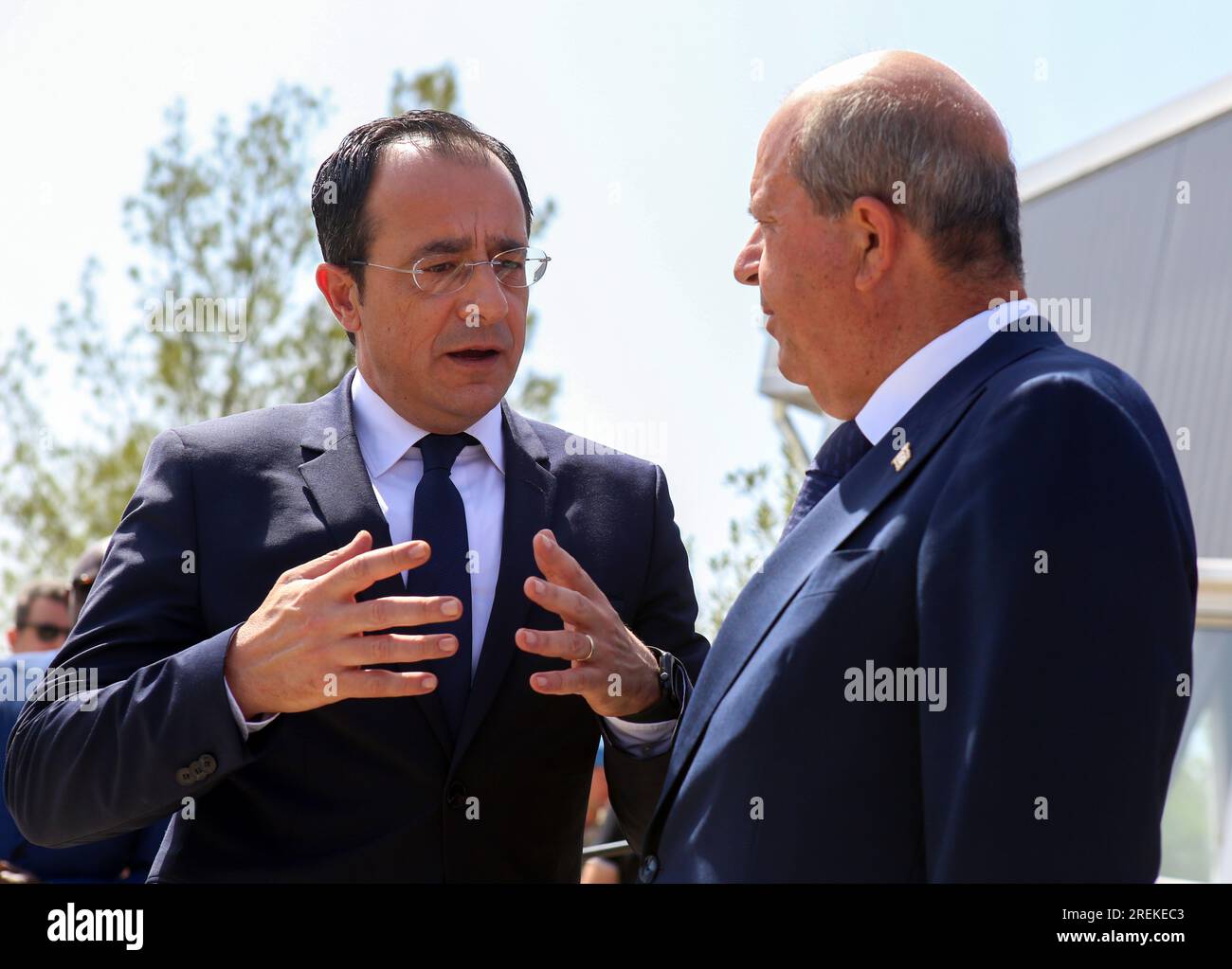 Nicosia, Cyprus. 28th July, 2023. Cyprus' President Nikos Christodoulides (L) and Turkish Cypriot leader Ersin Tatar talk after their meeting at the headquarters of the United Nations (UN)-led Committee on Missing Persons (CMP) in the old Nicosia airport complex in Nicosia, Cyprus, on July 28, 2023. Leaders of ethnically divided Cyprus held a meeting on Friday, jointly appealing to people to provide information that would help locate missing persons in conflicts, which date back almost to the establishment of the Cypriot state. Credit: George Christophorou/Xinhua/Alamy Live News Stock Photo