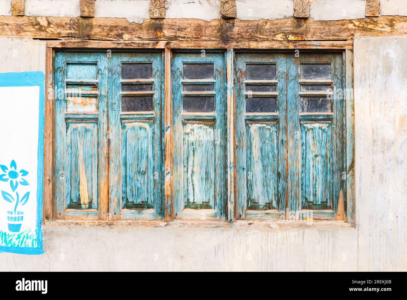 Sumbal Bala, Kangan, Jammu and Kashmir, India. Blue peeling paint on ...