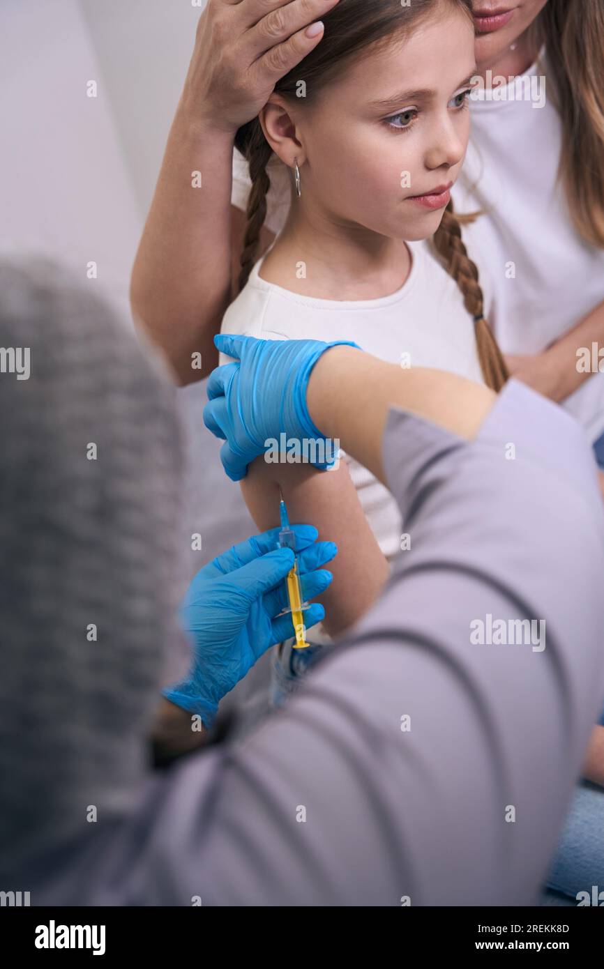 Girl gets an injection hi-res stock photography and images - Alamy