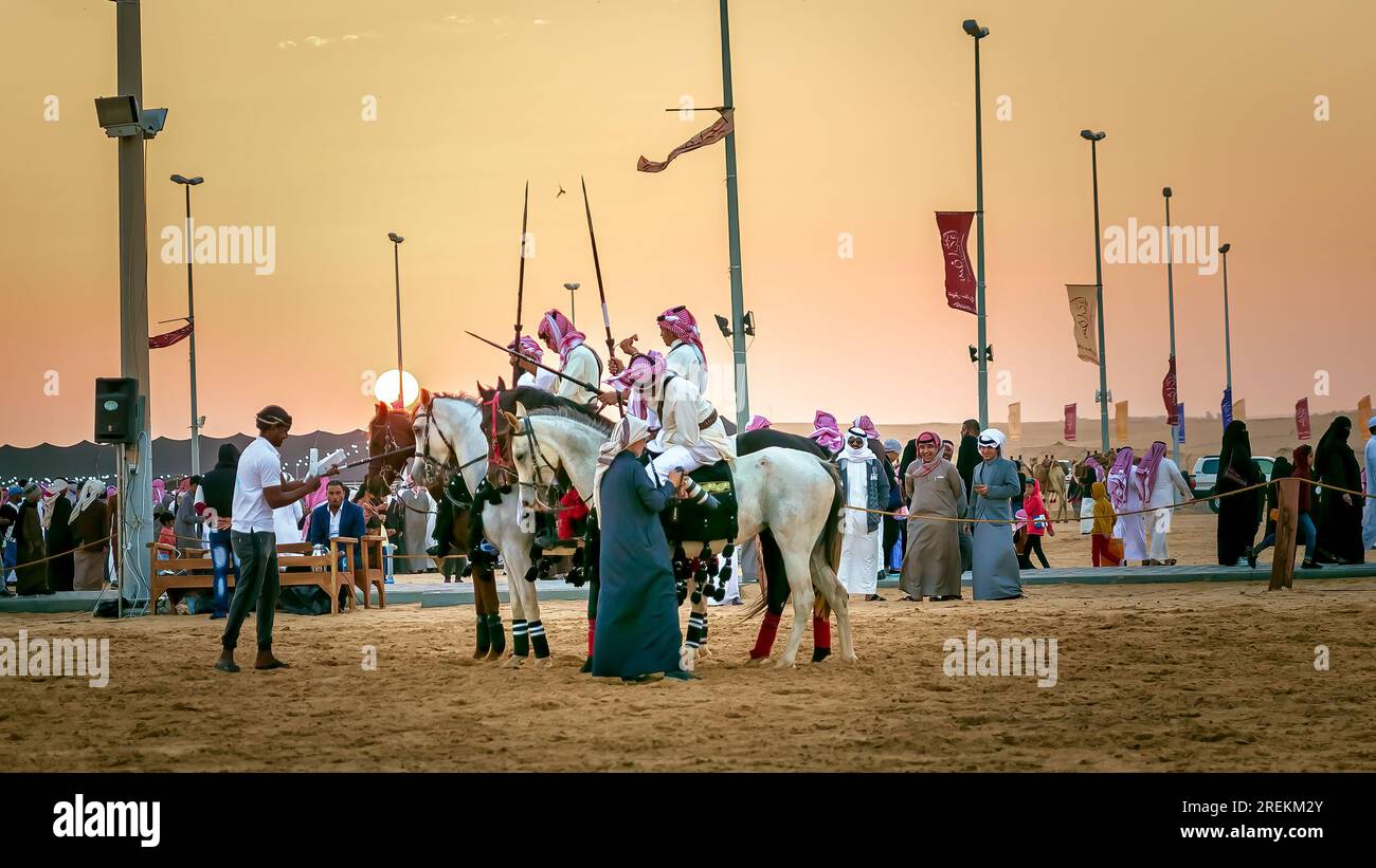 Saudi Arabian male horse riders in action. Dammam is a city in Saudi Arabia. Stock Photo