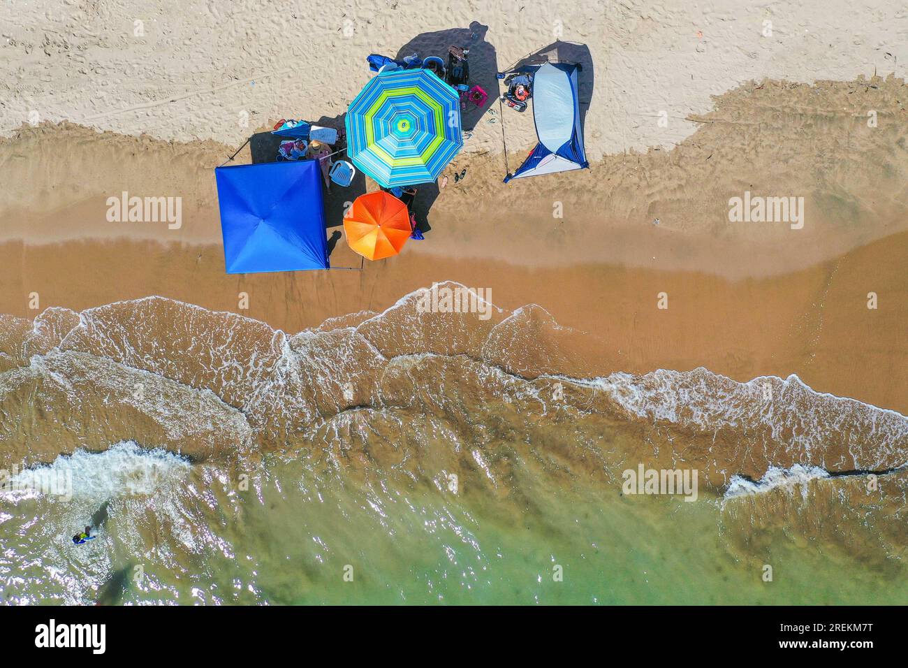 Aerial view of beach umbrellas for the sun Aerial shot, of Bahia de Kino, Sonora Mexico. real